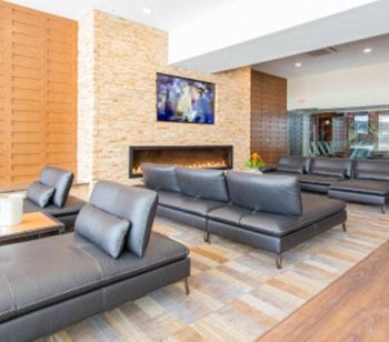 A resident lounge offers a flatscreen TV and gas fireplace
